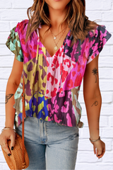 Ruffled Printed Tie Neck Cap Sleeve Blouse