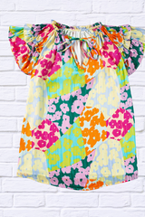 Ruffled Printed Tie Neck Cap Sleeve Blouse